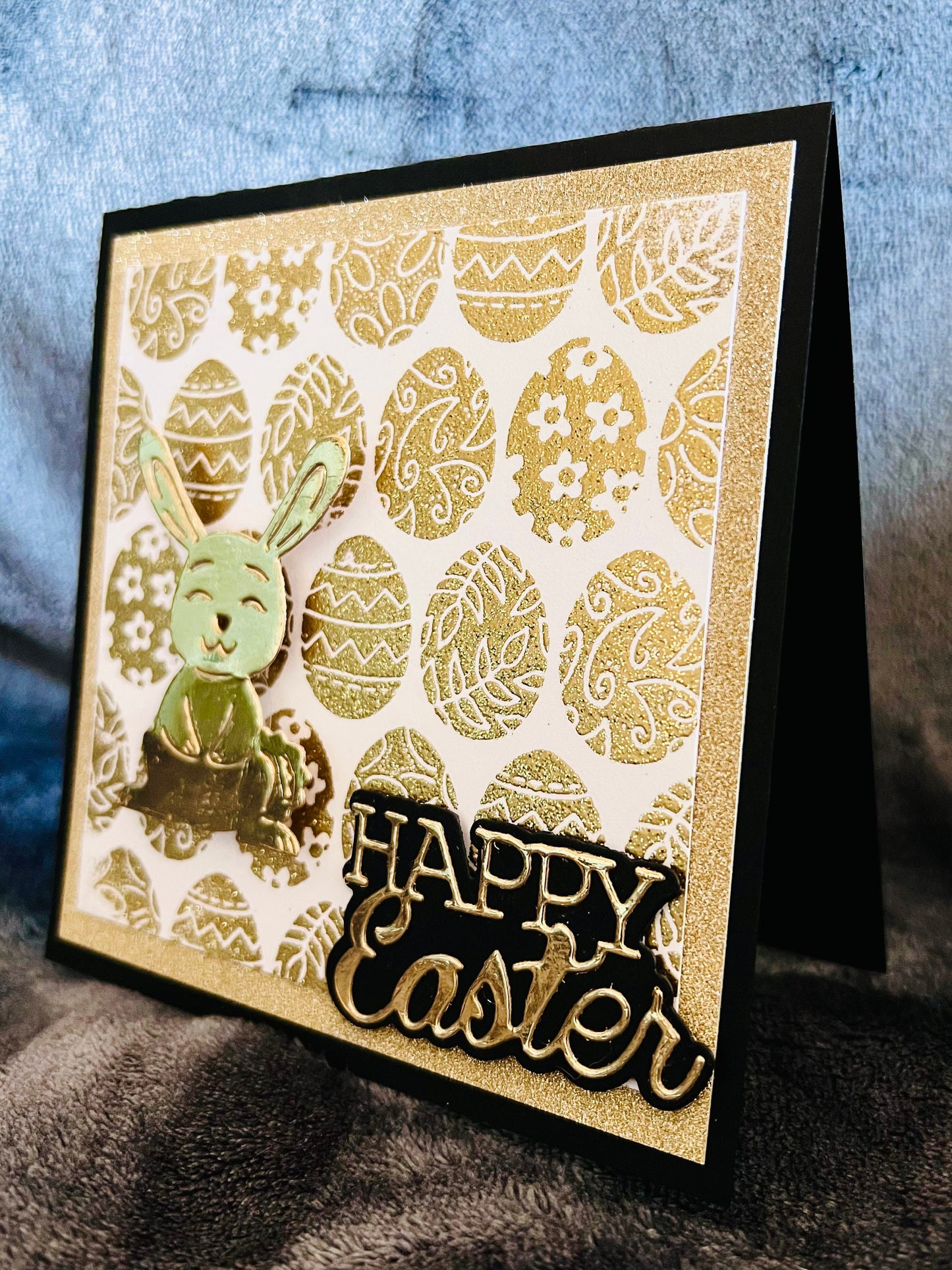 Golden Wobbler Rabbit Easter Greeting Card - A Shimmering Holiday Wish with Playful Bunny Design for Spring Celebrations