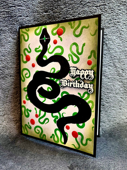 Black Foiled Serpent with Small Green Serpent Background Birthday Card