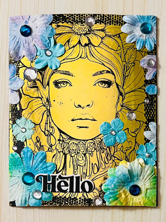Gold Foiled Woman with Floral Headdress Surrounded with Blue Paper Flowers Hello Card