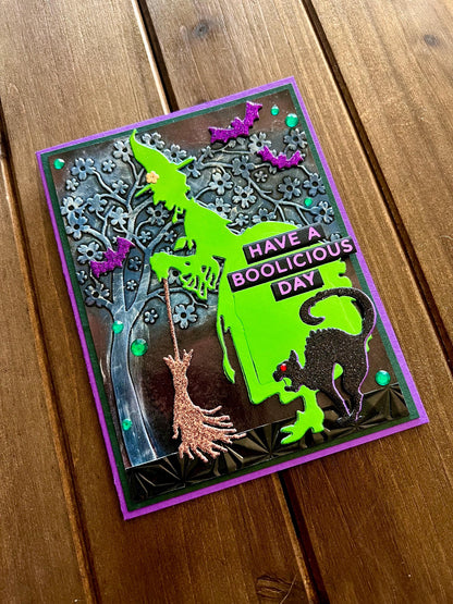 Green Silhouette Witch with Cat and Bats and Floral Tree Halloween Card