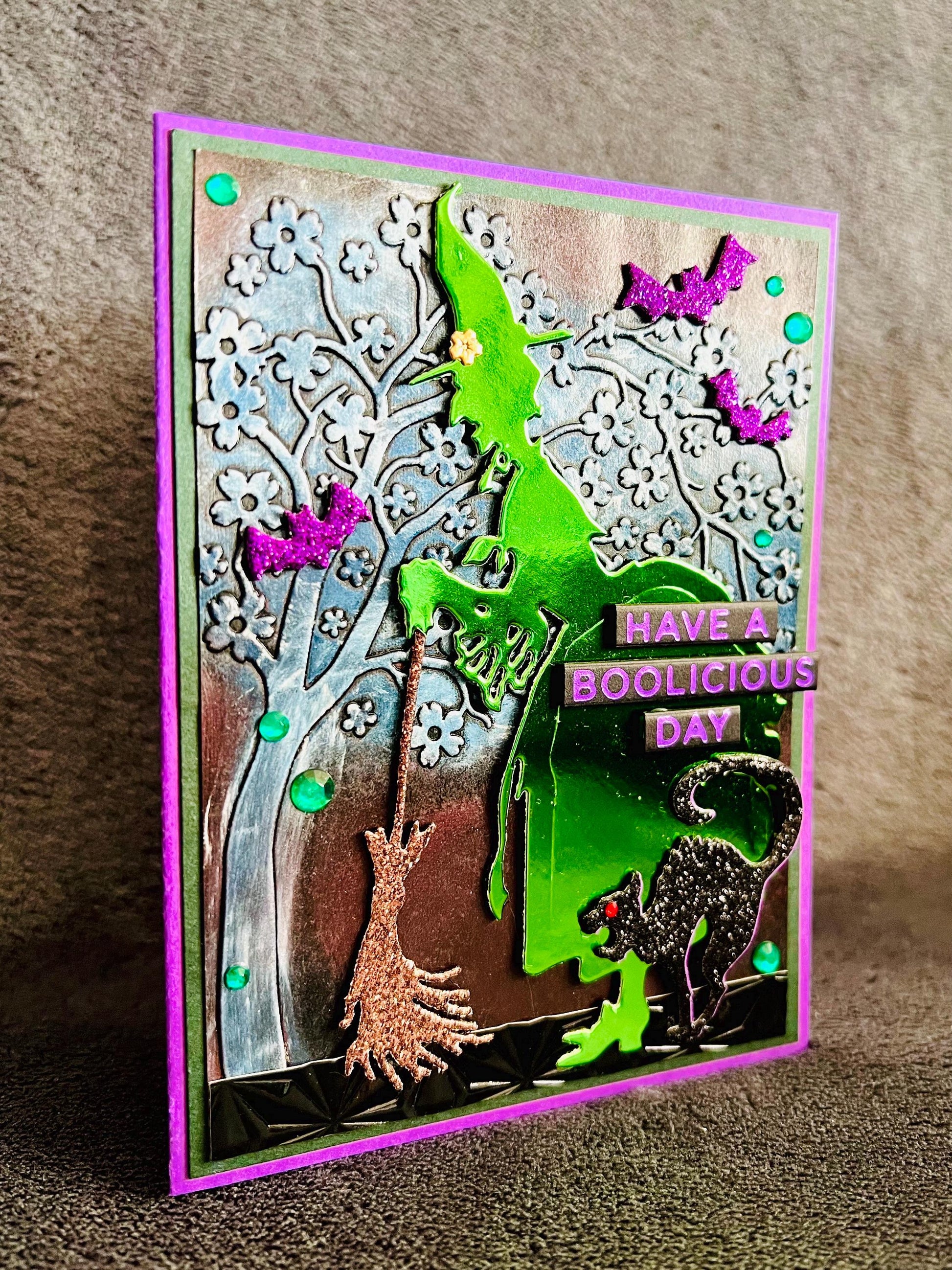 Green Silhouette Witch with Cat and Bats and Floral Tree Halloween Card
