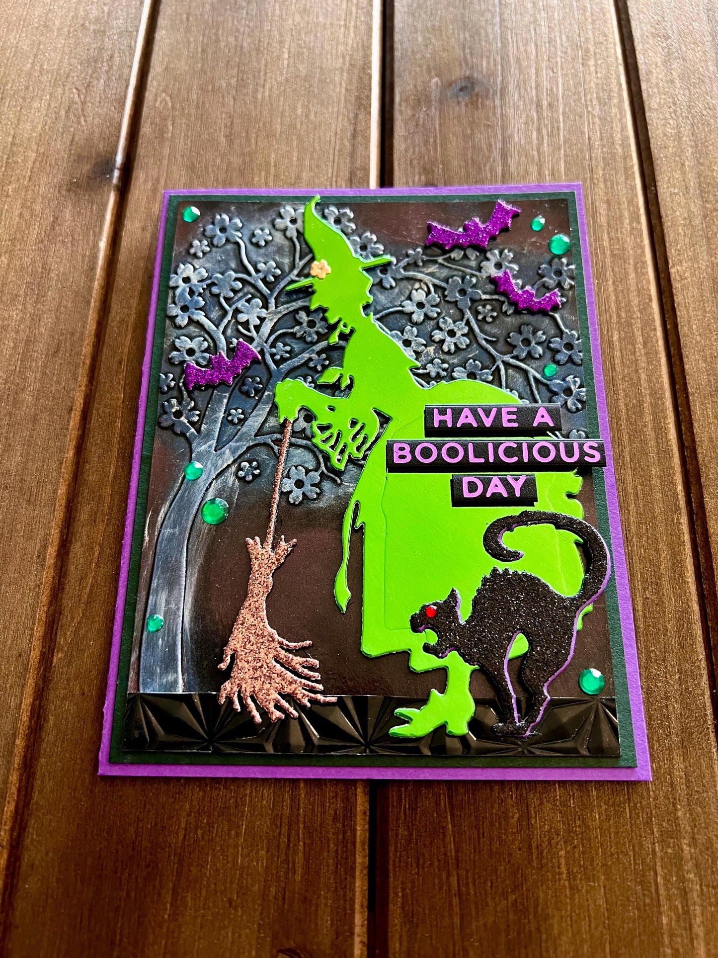 Green Silhouette Witch with Cat and Bats and Floral Tree Halloween Card