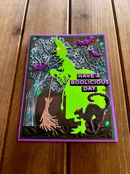 Green Silhouette Witch with Cat and Bats and Floral Tree Halloween Card