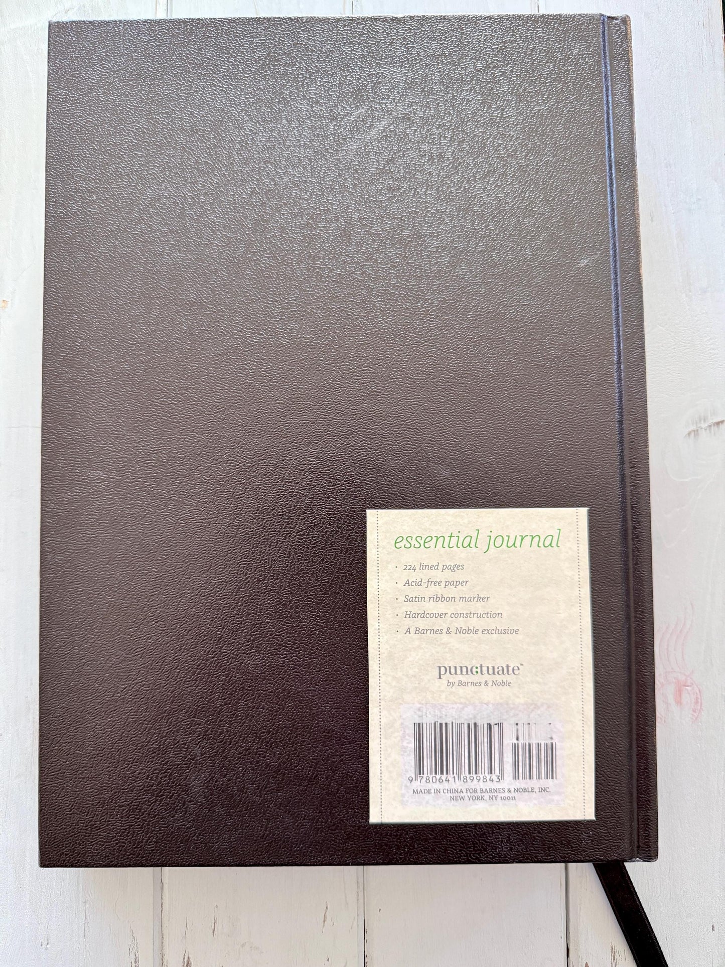 A decorative Heart Key embellishment is coated in clear resin on a hardcover journal measuring 10”x7.5”x1”