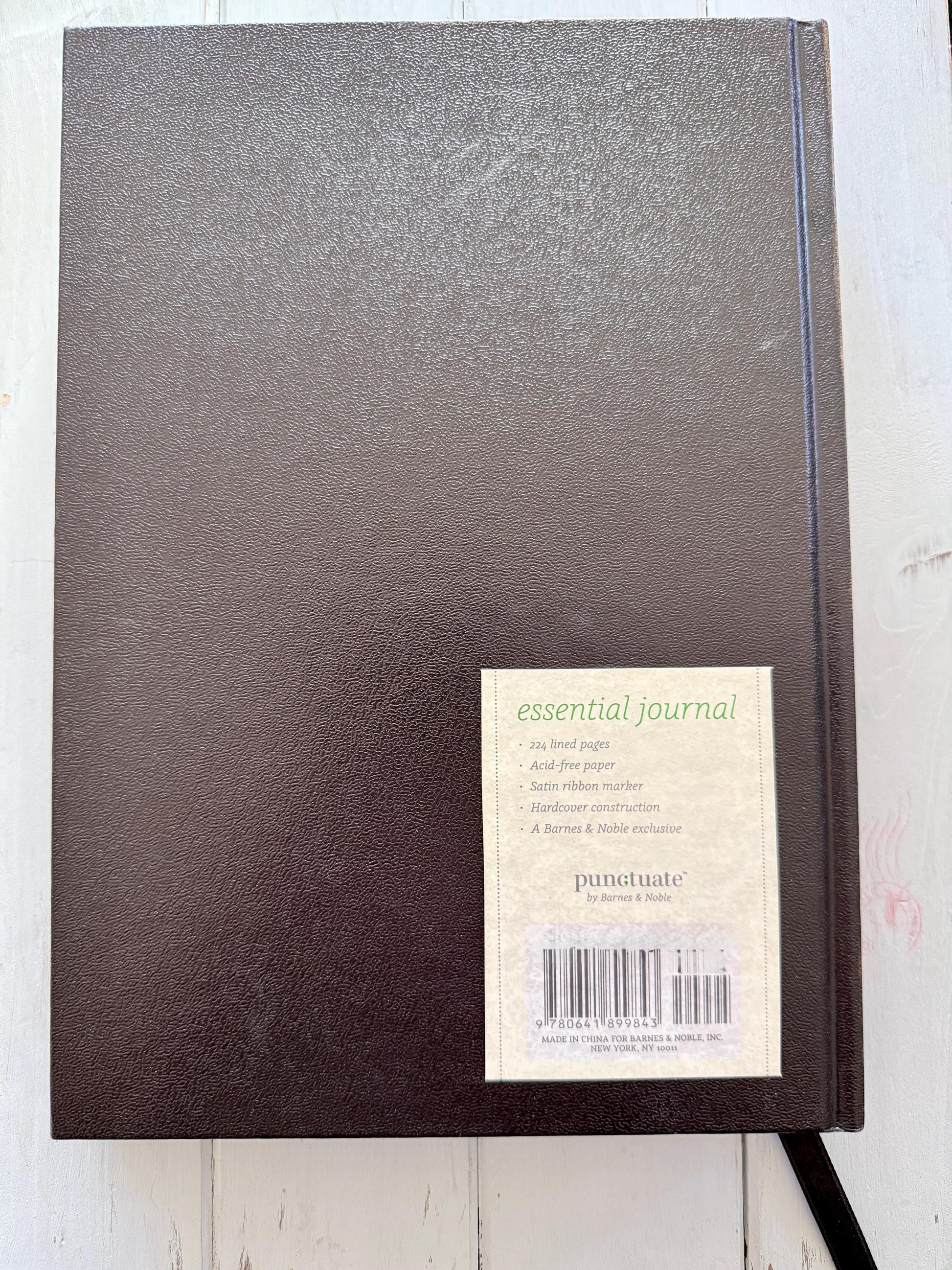 A decorative Heart Key embellishment is coated in clear resin on a hardcover journal measuring 10”x7.5”x1”